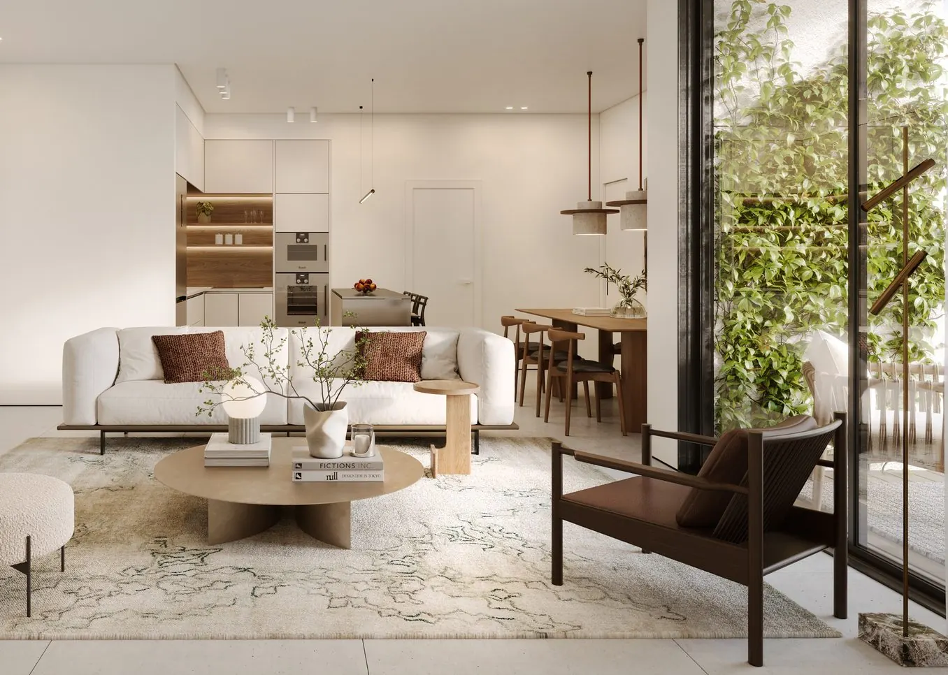 Open-plan living room and kitchen with a sofa, round coffee table and dining area